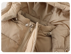 Close-up of windproof fabric and metallic zipper on baby winter down jacket