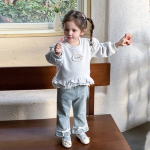 Toddler girl spring set with white ruffled sweatshirt and light blue flared jeans