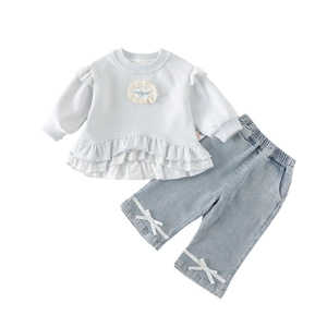Toddler girl two-piece outfit with light blue ruffled sweatshirt and bow denim jeans