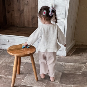 Toddler girl two-piece casual set with cream ruffle sweatshirt and soft pink pants