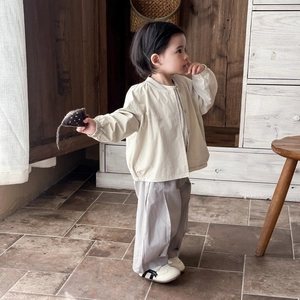 Infant cotton jacket and pants set with elephant print and Voyage text in beige