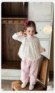 Detail view of floral baby girl outfit set certified as Class A Grade 1 safety standard