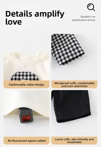 Detail view of baby boy white plaid shirt collar, windproof cuffs and safe fabric texture