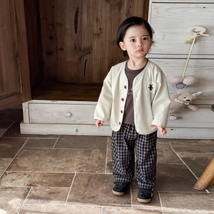 Toddler boy three-piece clothing set with beige cardigan, brown shirt and checkered pants