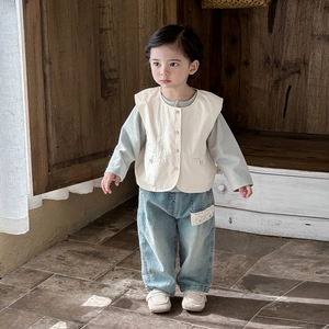 Three-piece baby boy casual outfit with beige vest, green shirt and blue jeans