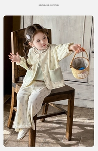Detail of floral baby girl loungewear set with ruffled collar and waffle knit texture