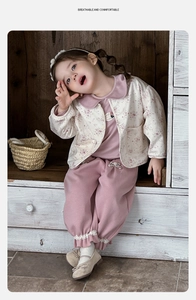 Detail of toddler girl floral cardigan set with lace hem pants and bow shoes