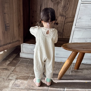 Baby girl spring set featuring lace collar shirt and floral suspender pants in warm tones