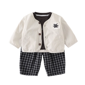 Three-piece baby boy outfit with cream cardigan, bear patch, t-shirt and plaid shorts
