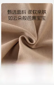 Close-up of soft breathable khaki knit fabric showing detailed texture and flexibility