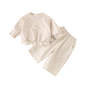 Completo due pezzi per bambina con top a balze e pantaloni a fiori primaverili