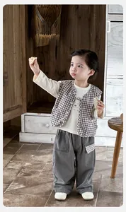 Three-piece toddler boy set with brown plaid vest, bear tee, and grey cargo pants