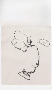 Close-up of cream knit cotton fabric featuring a minimalist line-drawn elephant and Hello text