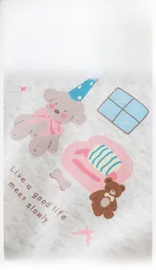 Detailed close-up of grey cotton knit fabric with cute embroidered puppy and bear patterns