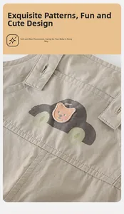 Detail of khaki cotton baby suspenders featuring cartoon bear embroidery and car prints