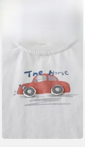 Close-up of white cotton baby t-shirt with red cartoon car print and ribbed neckline