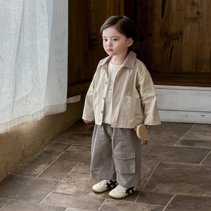 Three-piece boy toddler spring outfit with beige utility jacket and cargo pants