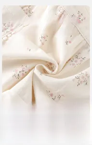 Macro detail of soft cotton floral fabric showing breathable and fluffy texture