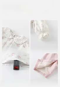 Detail shots of floral top and pink pants set showing neckline, cuffs and safety fabric