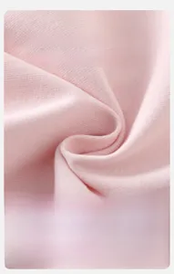 Close-up of soft pink ribbed cotton fabric detail showing breathable and fluffy texture