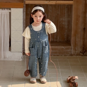 Toddler girl two-piece outfit featuring a puff sleeve knit top and blue floral denim overalls