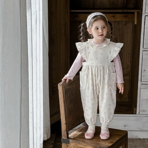 Girls vintage floral two-piece set with pink ribbed top and ruffled floral jumpsuit