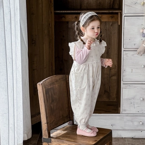 Floral baby girl romper set with long sleeve shirt and ruffled lace details for spring