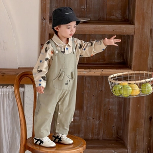 Infant boy outfit set featuring green overalls with puppy pocket and animal print shirt