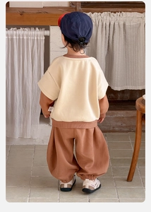 Back view of a casual toddler tracksuit with beige hoodie and brown lantern pants