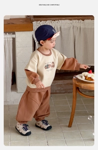 Detail view of toddler boy beige and brown lounge set with cute guinea pig illustration