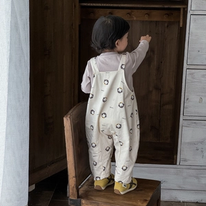Toddler boy two-piece set featuring penguin print overalls and purple long sleeve shirt