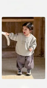 Detailed view of baby boy cotton sweatshirt set featuring cute bear cartoon prints