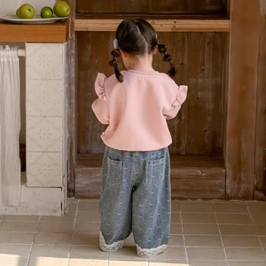 Toddler girl outfit featuring pink ruffle sweatshirt and bow print lace hem jeans