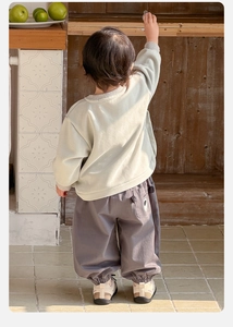 Detail view of toddler cargo pants with cute bear illustration on the back pocket