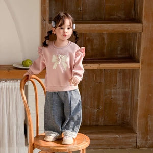 Toddler girl pink ruffle sweatshirt with bow print and lace-trimmed wide-leg jeans outfit