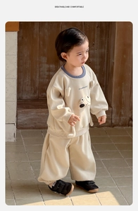 Detail of baby boy beige cotton sweatshirt and joggers set with cartoon dog print