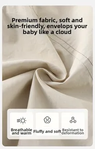 Detailed close-up of soft breathable cream white fabric for baby hooded jackets