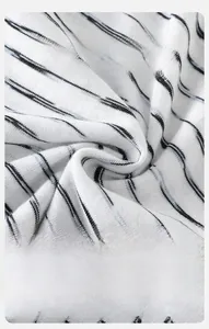 Detail of breathable and soft black and white striped knit fabric for baby clothes