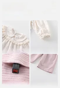Details von Blumenkragen und Manschetten an Babykleidung aus Baumwolle mit Sicherheitstest