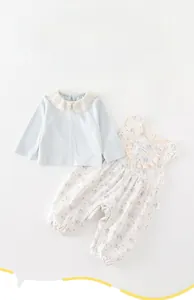 Detailed view of baby girl floral overalls set with lace collar long sleeve shirt