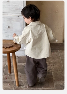 Detail of baby utility jacket in beige with dark brown wide-leg pants for toddler outfit