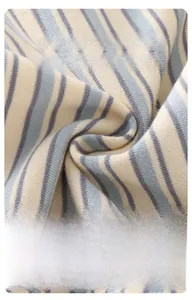 Close-up of soft blue and white striped knit fabric for baby boys polo shirt