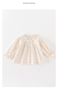 Close-up of girls floral blouse with ruffled collar and elastic cuffs on white background