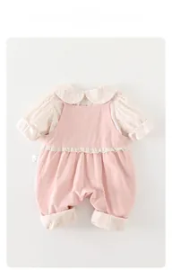 Detail of pink toddler overalls and floral blouse with a delicate Peter Pan collar