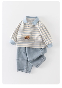 Detail of toddler polo sweatshirt with striped pattern and cute car embroidery design
