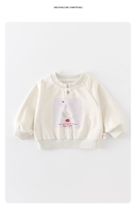 Detail of baby off-white long sleeve sweatshirt with wooden button and duck print
