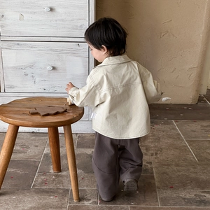 Stylish beige hooded jacket and brown pants set for toddler boys in casual spring style