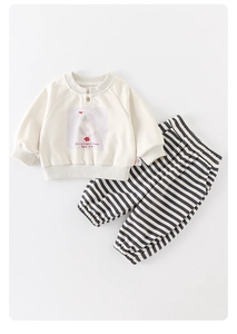Detail of baby cotton sweatshirt with cartoon duck print and striped jogger pants
