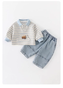 Detail view of baby boy striped polo shirt with car patch and elastic denim pants