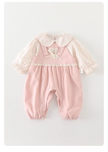 Detail of baby girl floral shirt with Peter Pan collar and pink lace bib overall pants